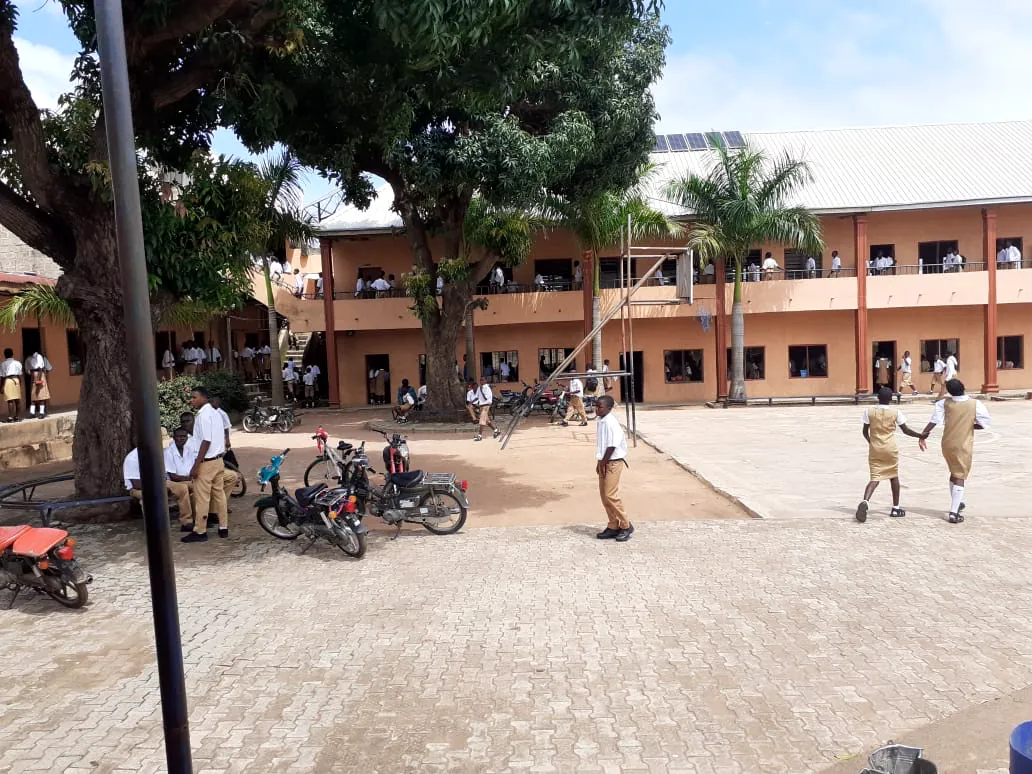 Students crossing the courtyard together at break time